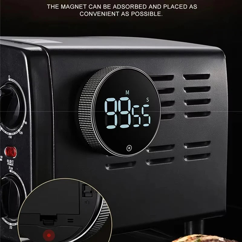 Black appliance with digital timer display on a dark background
