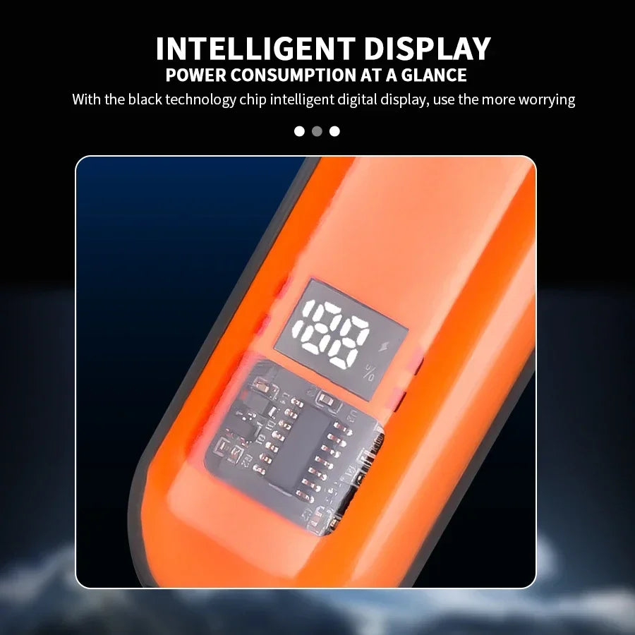 Orange ear and nose hair trimmer with digital display on a dark background