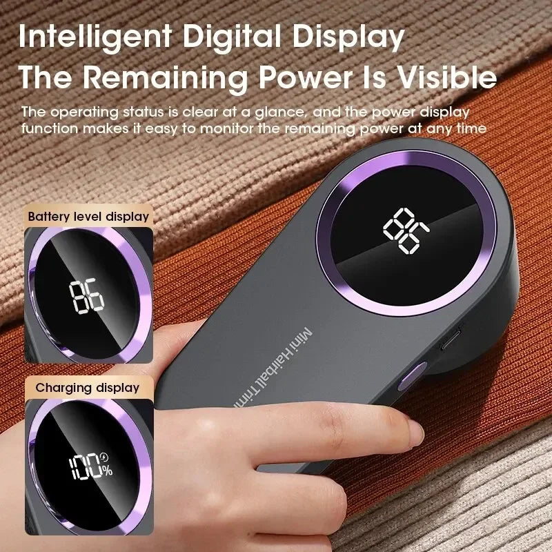 Electric lint remover with digital display and fabric shaver head display showing battery level and charging status, held by a hand.