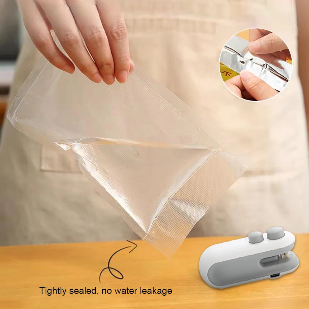 Person sealing a clear plastic bag with a sealing device on a wooden surface.